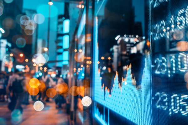 Image of bar graph with number overlaid on top a night time photo of city lights.